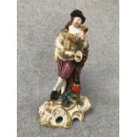 Meissen figure of a 'Musician', with blue crossed mark to the base, 20cm H