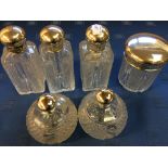 Set of 6 hallmarked silver topped cut glass scent bottles & jars (6)