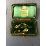Pair of emerald & gold drop earrings in leather box, 3.2g