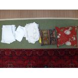 2 cushions & qty of various linen & table cloths etc.