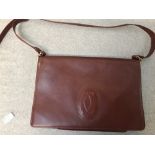 Ladies Cartier brown leather handbag with brass label inside 'Le Must de Cartier Paris'