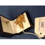 9 carat gold horse head brooch with a cabochon sapphire eye, 3.5 cm across, 16.3g gross