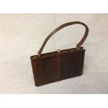 Dark brown crocodile handbag