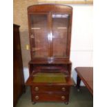 A George III mahogany secretaire bookcase with a pair of plain glazed doors, deep secretaire drawer,