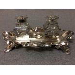 Hallmarked silver desk ink stand of 2 glass bottles on Rococo base