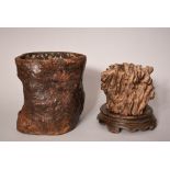 Two C19th Chinese carved wood root-form brush pots, 23.5cm high max, one wood stand. (2) Provenance: