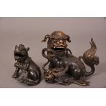 Two Chinese bronze Buddhist lions, 13.6cm high max. (2) Please check condition before bidding