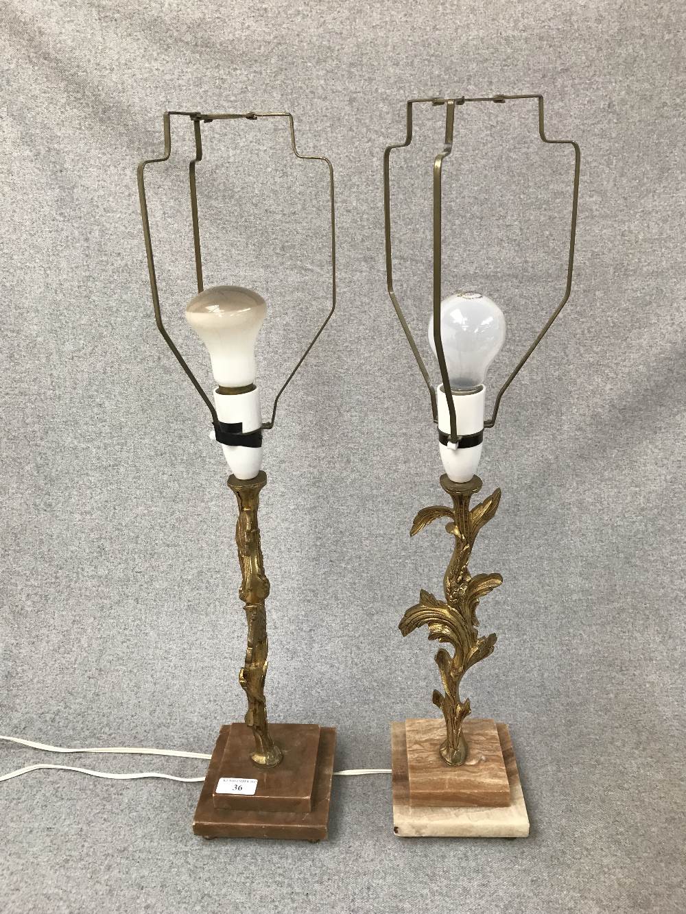 Pair of gilt table lamps with stepped marble style base