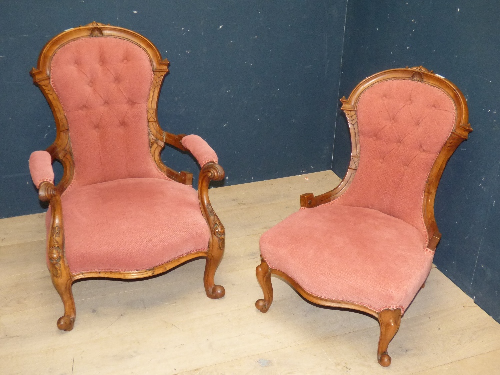 A good Victorian walnut framed button upholstered armchair with a matching side chair