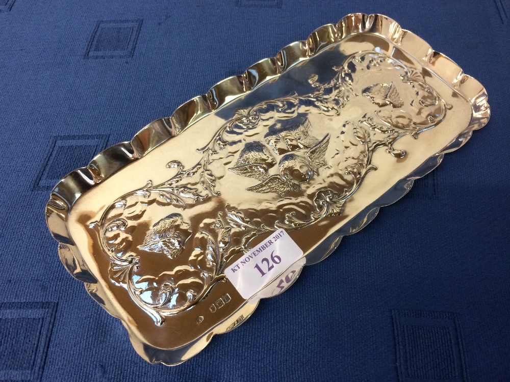 Hallmarked silver oblong tray with embossed foliate decoration around angels heads, 23cm L