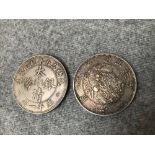 2 Chinese silver coins, 4cm dia. Please check condition before bidding