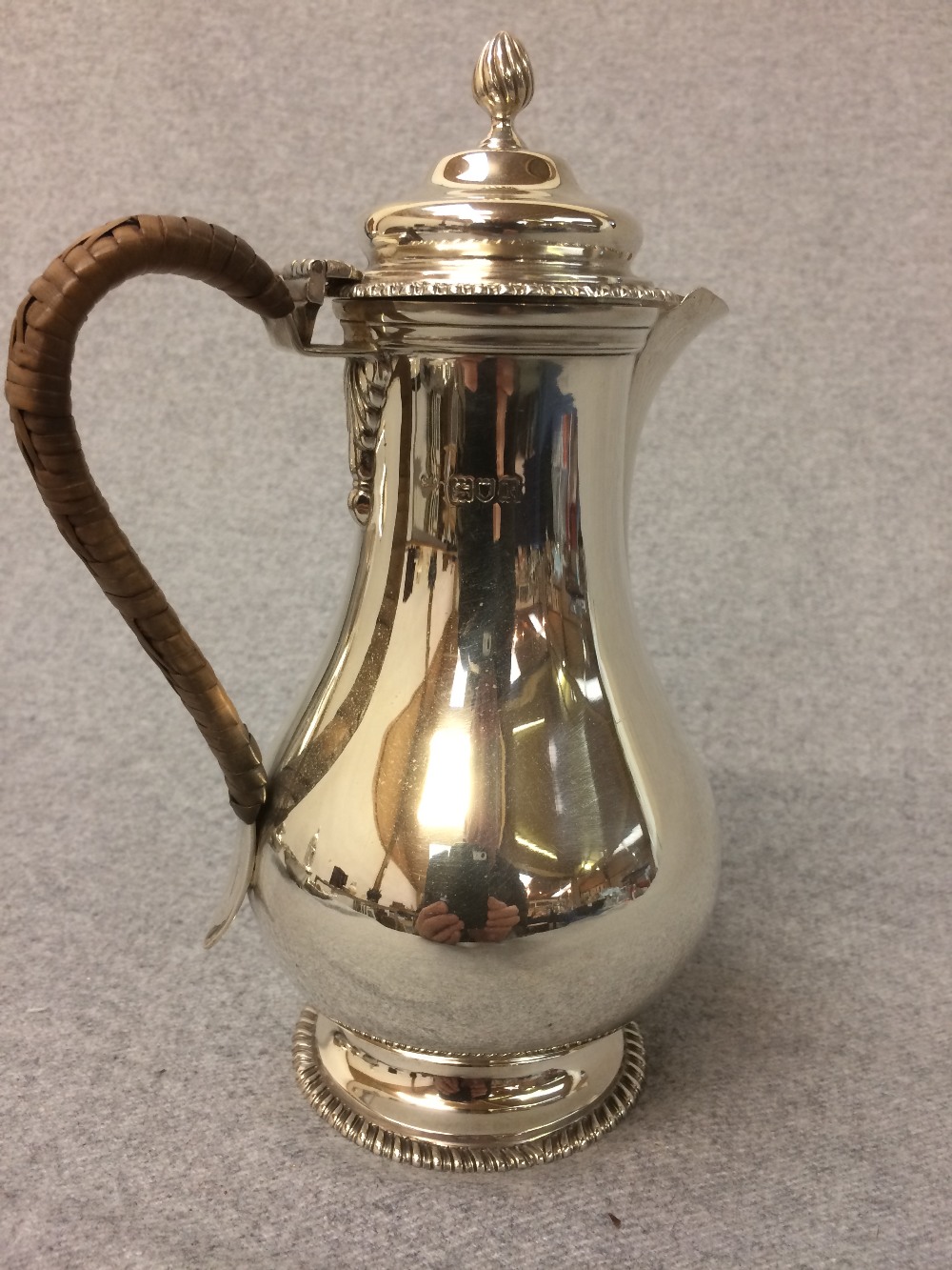 Hallmarked silver hot water jug with cane handle, London 1905, 14.5 ozt