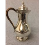 Hallmarked silver hot water jug with cane handle, London 1905, 14.5 ozt