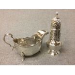 A hallmarked silver sugar caster London 1971 of shouldered baluster form with wrythen decoration