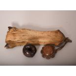 A fur pouch 24cm long; together with a carved wood fruit. (2) Provenance: From the Collection of