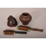 A carved hardwood lotus-form cup; together with a bamboo jar; and two handled combs. (4) Provenance: