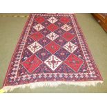Persian oblong rug, Central panel of 23 squares loztenges within geometric border approx. 225 x 150