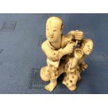 Small ivory figure group of two Chinese figures in robes, 7cm H Please check condition before