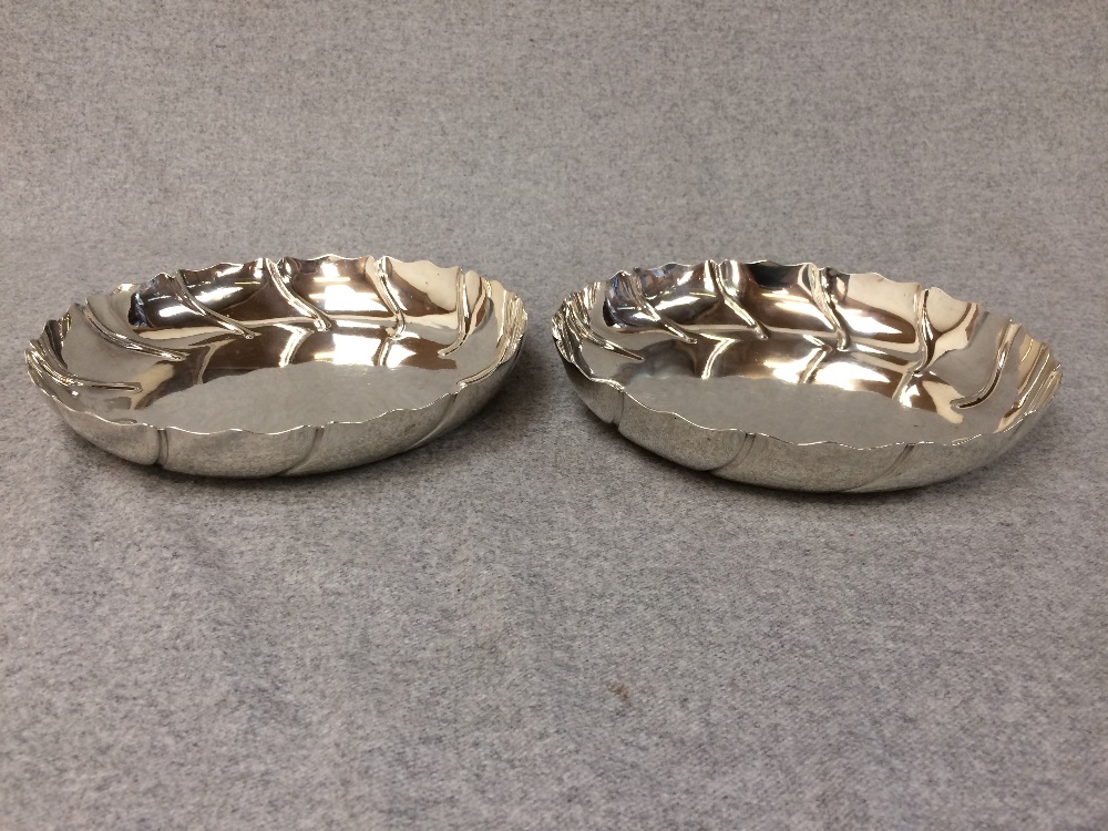 Pair of hallmarked silver late Victorian strawberry dishes with swirled hip borders by Dobson of