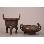 Chinese bronze tripod censer with twin upright handles, Ding, decorated with mandarin ducks amidst