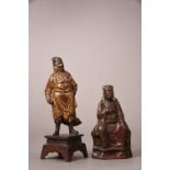 Chinese gilt-lacquered bronze figure of Guandi on stand, cast in standing position and dressed in