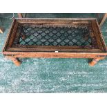 Indian style teak & metal bound coffee table with glass top 35H x 120W cm