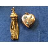 A turquoise and seed pearl heart shaped locket, stamped 'Real Gold', 3.8g gross with a tassel drop