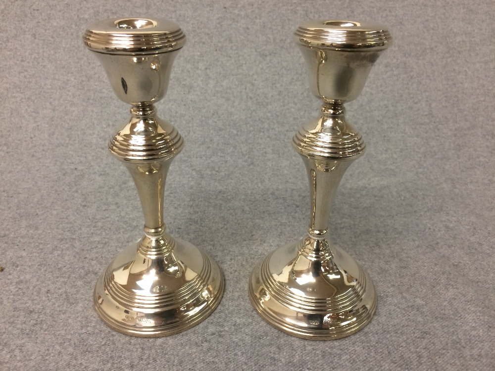 Pair of hallmarked silver circular candlesticks, Birmingham 1973, 18cm H