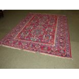 Red ground Persian rug, central panel and multi border with geometric all over pattern 220 x 165