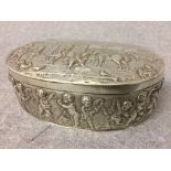 Hallmarked silver oval lidded box embossed with raised scenes of horses & figures