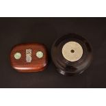 Chinese hardwood cylindrical box, the cover inlaid with a jade disc, 11.2cm diamter; together with a