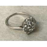 Diamond cluster ring set in white coloured metal, size 'P', 3.3g