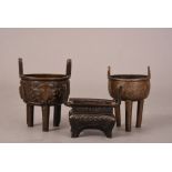 Chinese bronze tripod censer, Ding, cast with twin upright handles and decorated with taotie motifs,