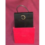 Ladies Cartier leather handbag, marked 'Cartier' on the buckle, 1990 with Cartier plastic card