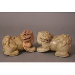 A pair of C19th Chinese soapstone archaistic lions, 15.6cm long. (2) Please check condition before