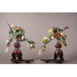 Pair of Chinese hardstone flower sparys in cloisonne enamelled vases, 20cm high, fitted wood stands.