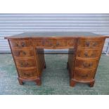 Edwardian walnut desk with tooled leather top 75H x 114W cm