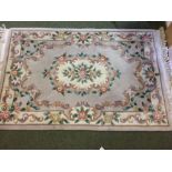 A Chinese beige ground rug 150 x 120