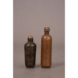 Two C18th/19th Chinese bronze snuff bottles, the first bottle carved with figures amongst foliage in