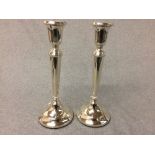 Pair of hallmarked silver circular candlesticks, London 1995, 27cm H