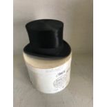 Black silk top hat by 'Christy's of London' in a 'Lock & Co.' cardboard hat box (hat 20 x 17 cm)