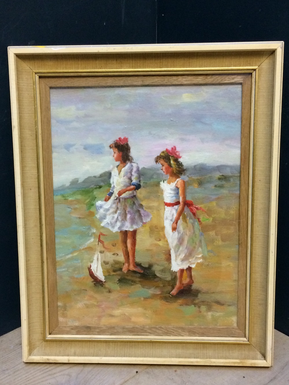 Oil painting, portrait of two girls on a sandy beach with model sailboat, 41x31.5cm