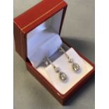 Pair of 18 carat white gold and diamond drop earrings, 1.2 carats
