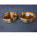 Pair of hallmarked silver bottle coasters with plain rims, London 1962