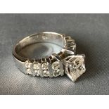 14 carat white gold and diamond ring, the princess cut central stone with brilliant cut shoulders,
