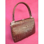 Dark brown crocodile handbag with twin handles