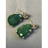 Pair of 18 carat white gold, emerald and diamond earrings with 7 carats of emeralds and 2 carats