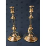 Pair of hallmarked silver circular candlesticks, London 1962, 26cmH