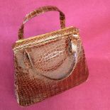 Brown crocodile handbag with matching crocodile mirror inside