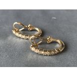 Pair of 14 carat white gold and diamond hoop earrings